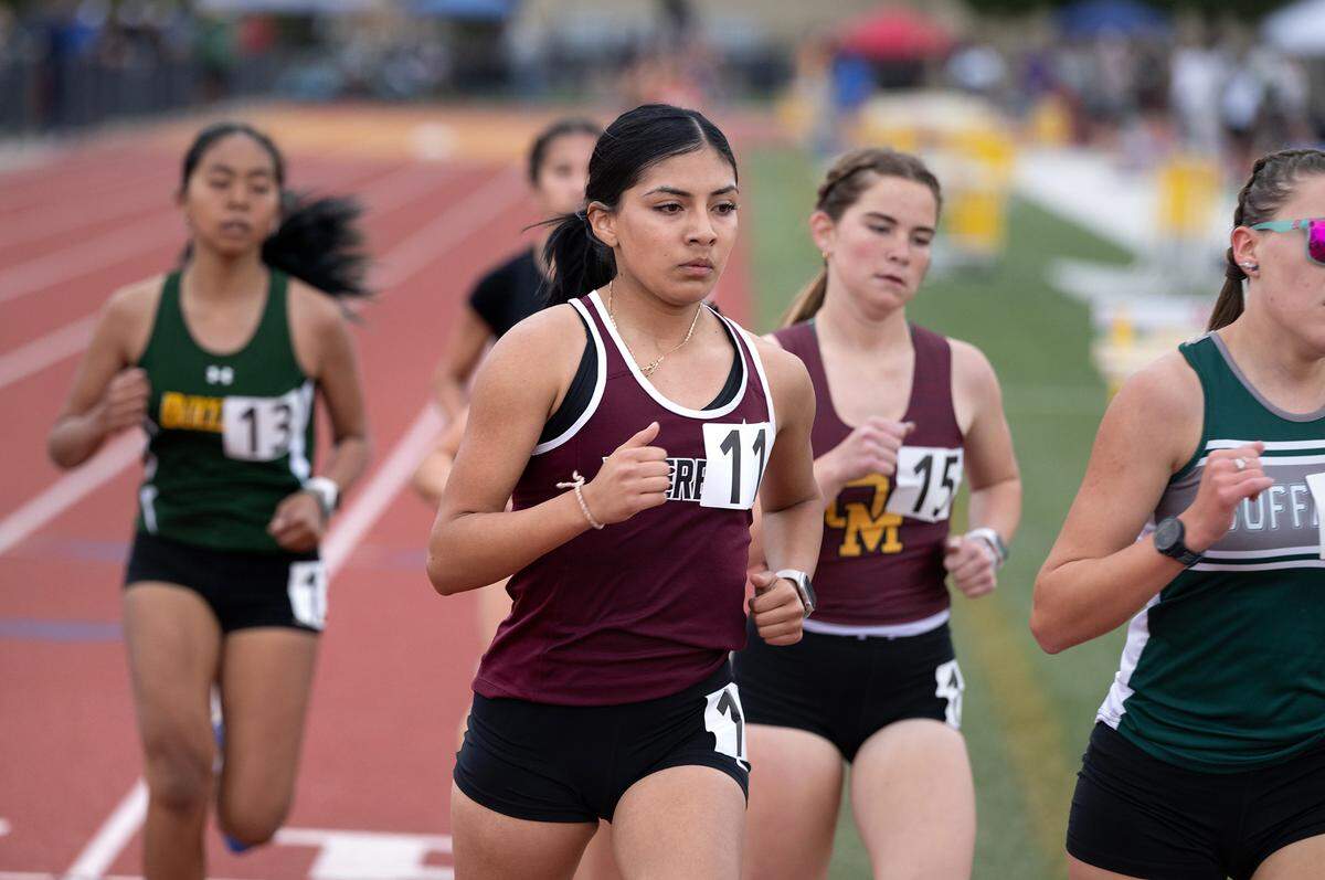 Riverbank’s Jessica Virgil (11) placed fourth in the 1600 meter race with a time of 5:39.23 during the County Clash track meet at Oakdale High School in Oakdale, Calif., Friday, March 22, 2024.