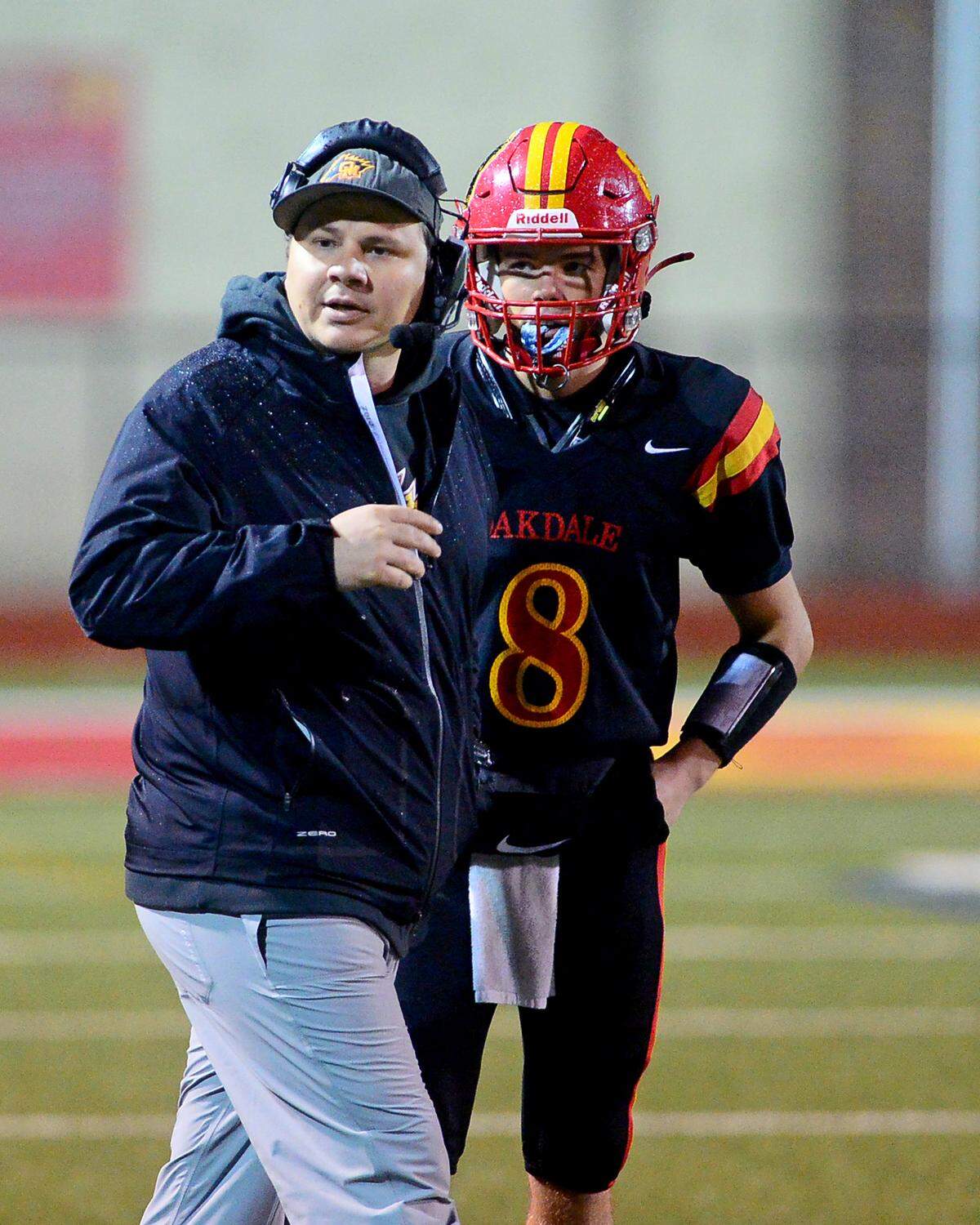 Oakdale Head Coach Garrett Martin looks towards the sidelines during a 2024 CIF Sac-Joaquin Section Division 3 playoff game between Oakdale High School and Destiny Christian Academy at Oakdale High School in Oakdale California on November 22, 2024. Oakdale won the game 49-35.