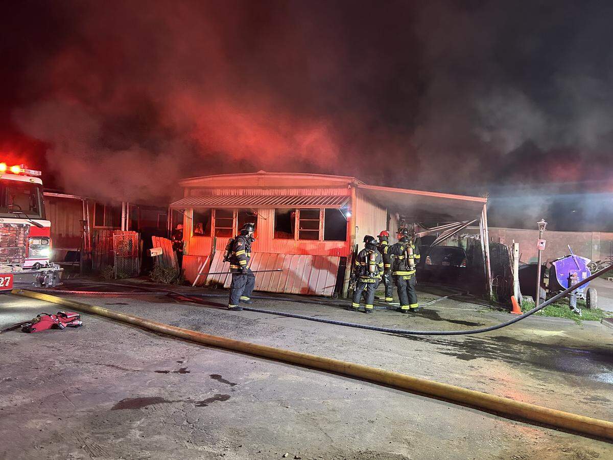 Crews contained the Oakdale mobile home fire in about 15 minutes. Four dogs were found inside but did not survive, authorities said.
