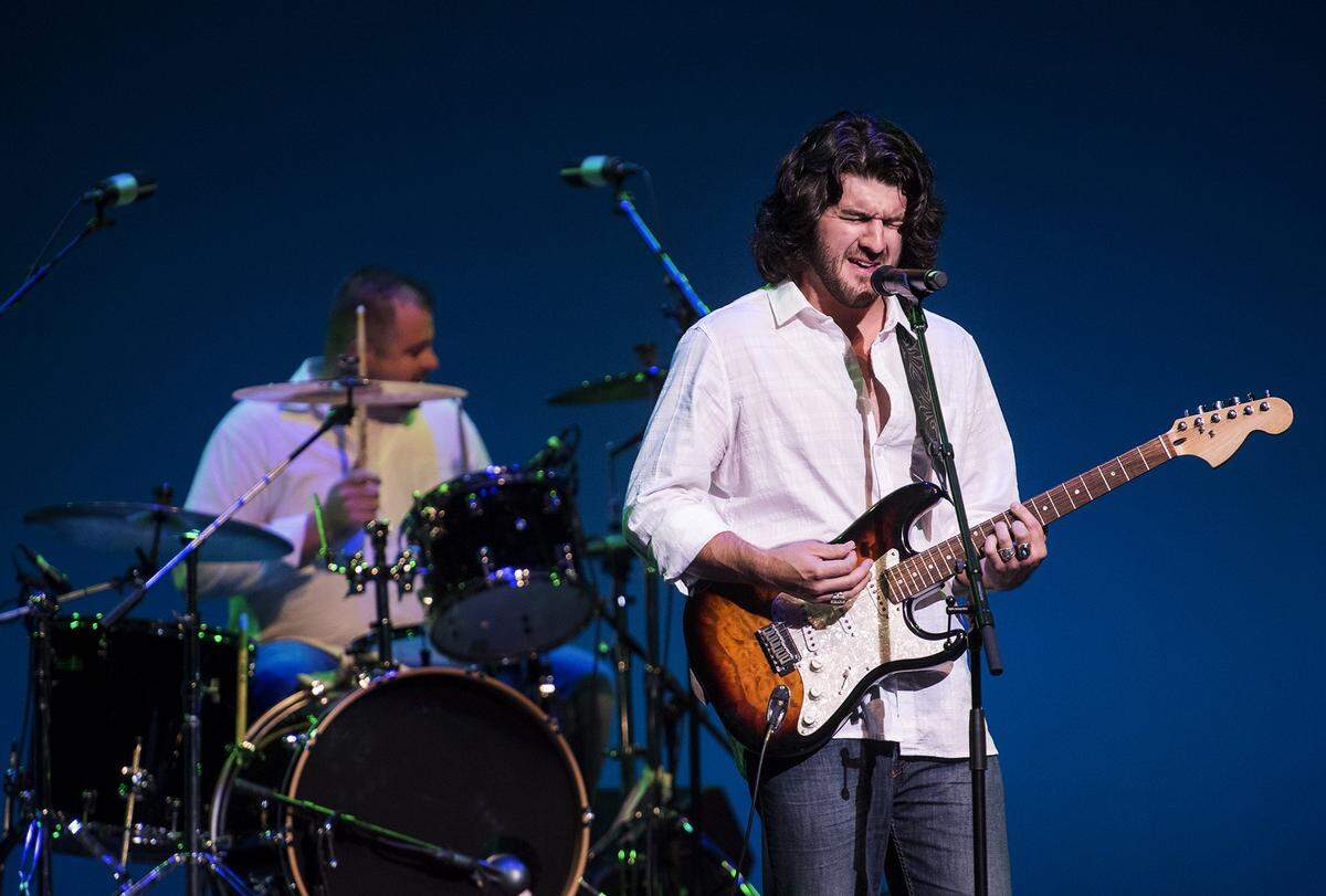 Alex Lucero sings with Live Again as they perform during 2015 talent competition at the Gallo Center.