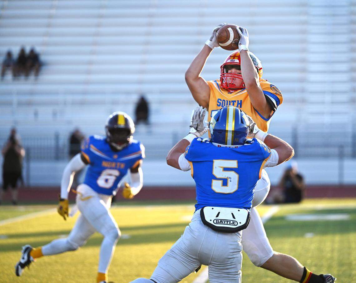 South team receiver Mick Merzon (Oakdale) makes a catch with coverage from the North’s Joe Cowan (Linden) during the Central California Lions All-Star Football Game at Tracy High School in Tracy, Calif., Saturday, June 24, 2023. The South won the game 38-13.