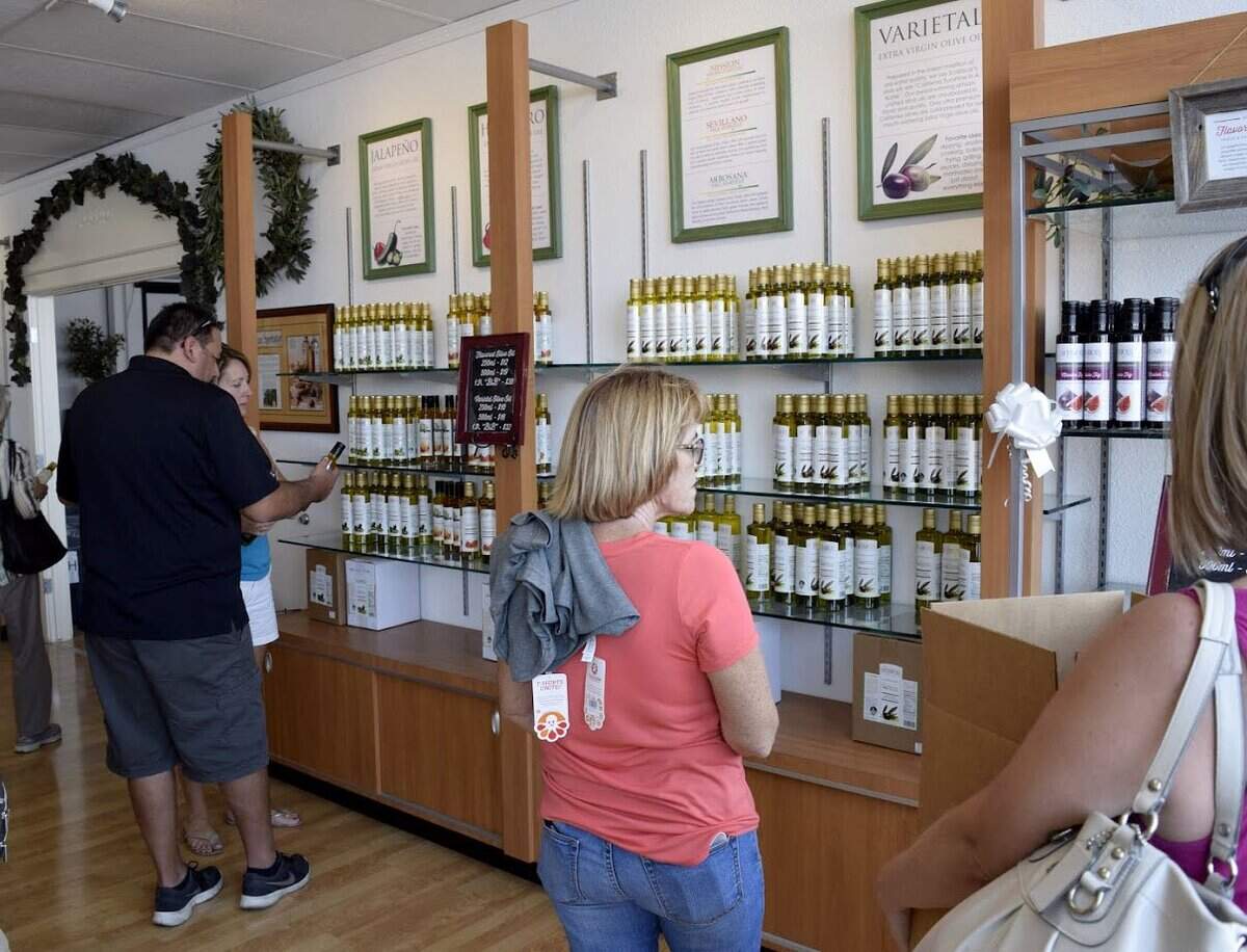 Customers browse during the 80th anniversary celebration at the Sciabica Olive Oil gift shop in 2016.