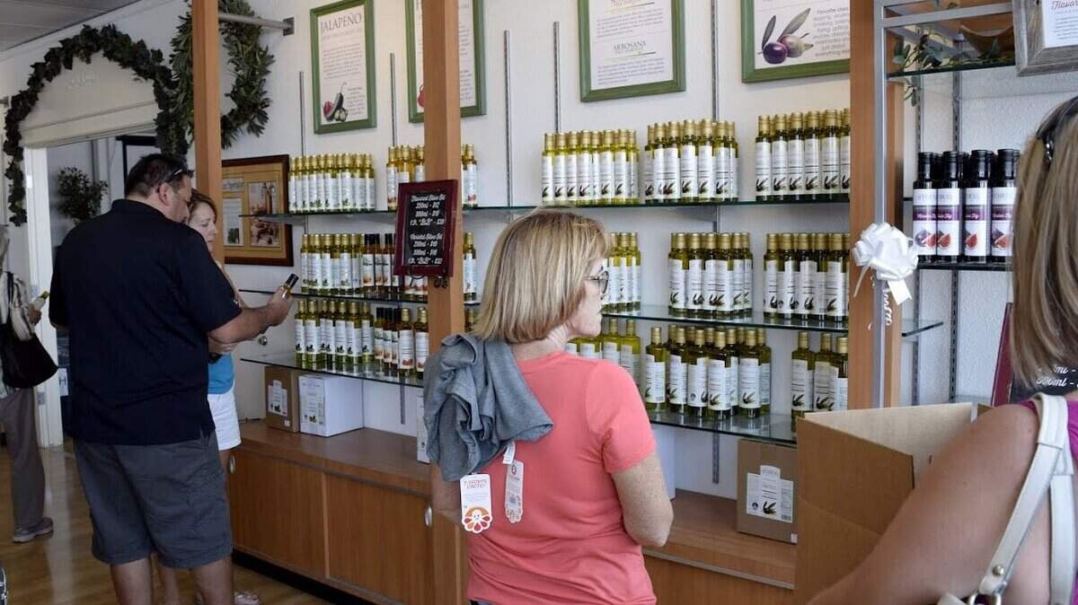 Customers browse during the 80th anniversary celebration at the Sciabica Olive Oil gift shop in 2016.