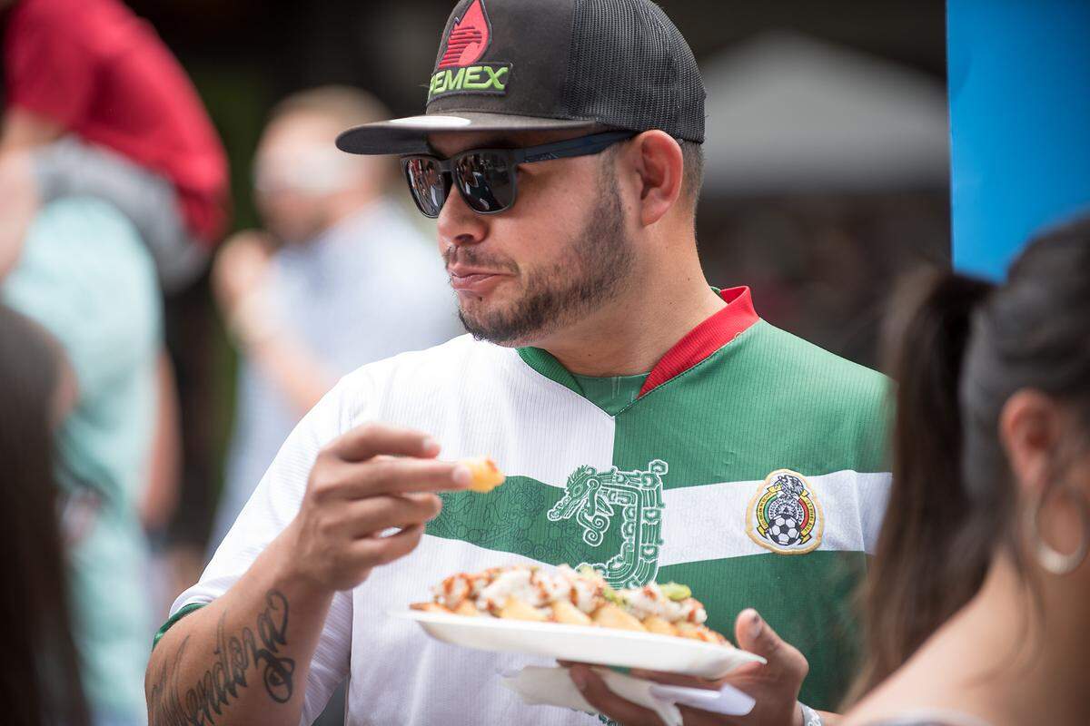 Saul Armaita enjoys food during Modesto Taco Fest in Modesto, Calif., Saturday, May 5, 2018.