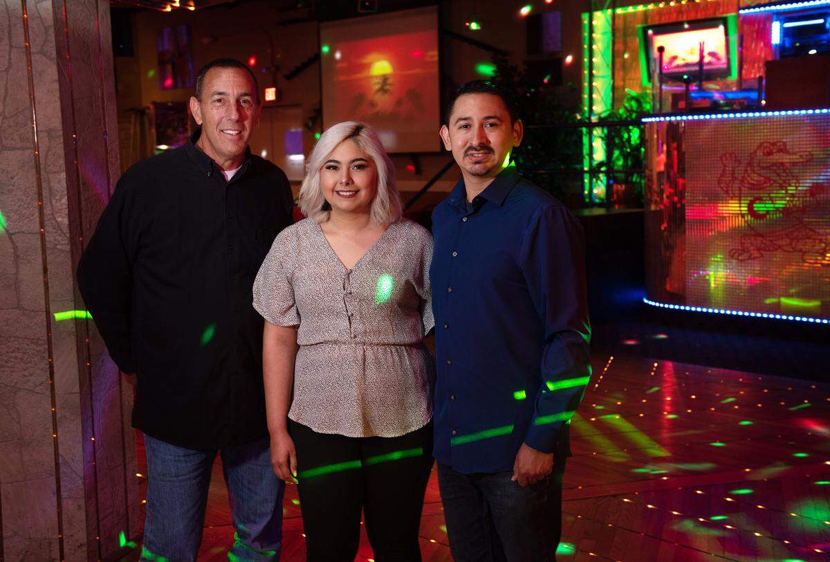Crocodiles owner Guy Phillips, left, has sold the nightclub to Kasandra and Christian Gonzalez. Photographed in Modesto, Calif., on Friday, July 15, 2022.