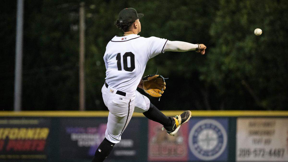 Modesto Nuts third baseman Luis Suisbel throws out a Stockton runner at John Thurman Field in Modesto, Calif., Friday, July 19, 2024.