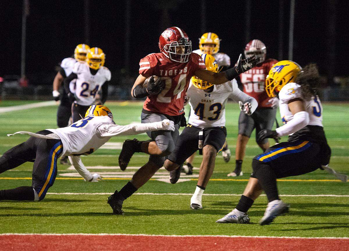 Patterson’s Lolo Mataele runs for a touchdown during a Sac-Joaquin Section Division III semifinal with Grant in Patterson, Calif., Friday, Nov. 18, 2022. Grant won 80-44.