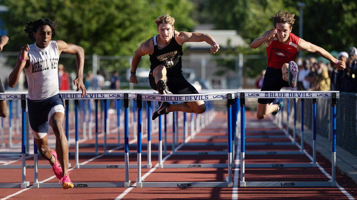 Hughson’s Larkin Meyer, middle, placed sixth in 110 meter hurdles with a time of 14.75 at the CIF Sac-Joaquin Section Masters track finals at Davis High School in Davis, Calif., Saturday, May 20, 2023.