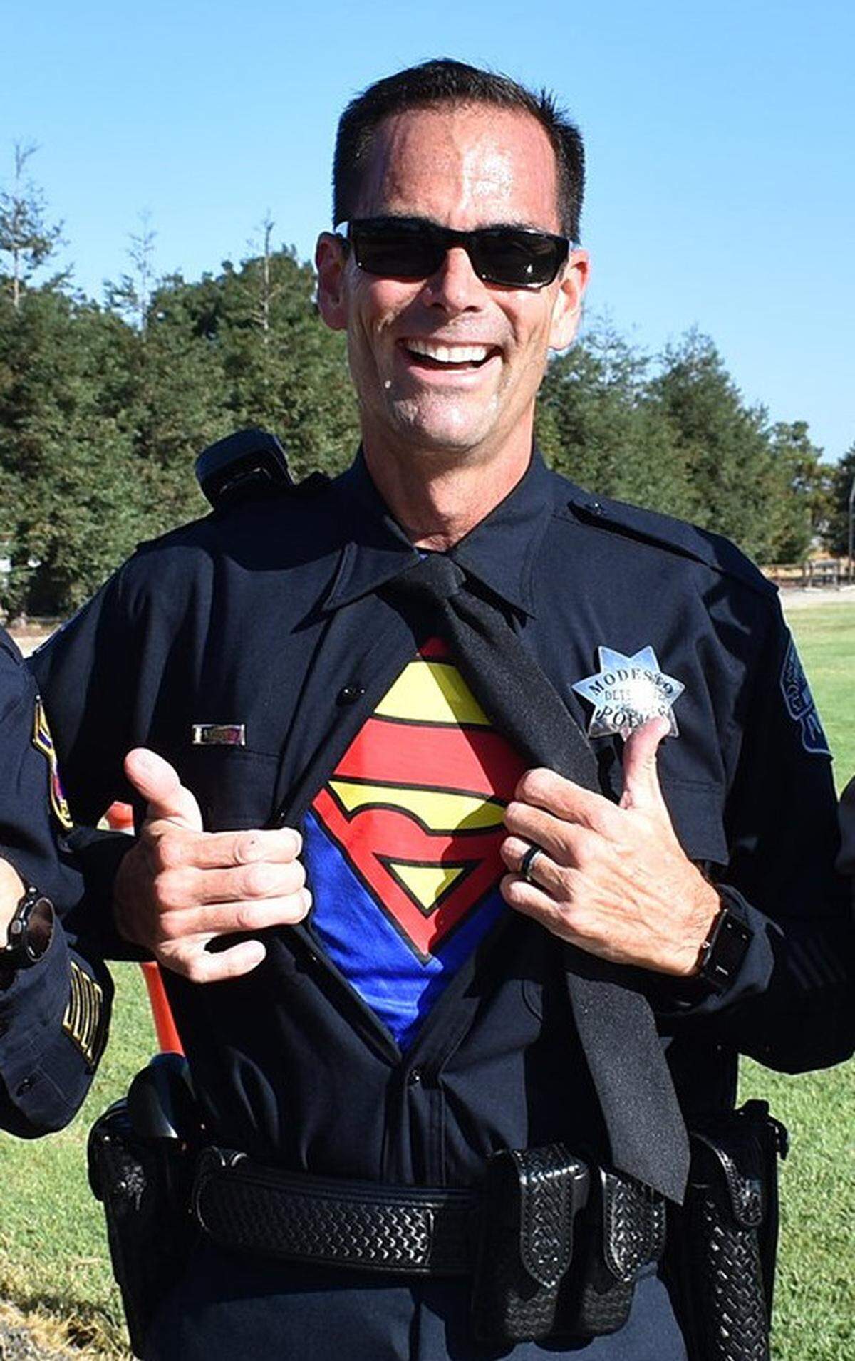 In 2017, while training for the Peace Officer Memorial Run, Modesto Police Department Detective Sean Dodge shows the Superman shirt under his uniform.