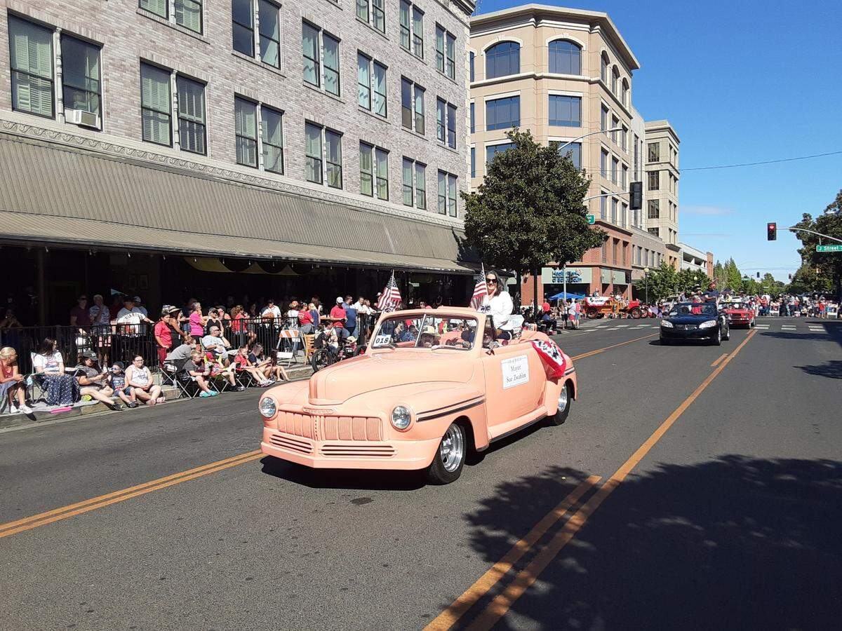 Mayor Sue Zwahlen rides in the Modesto, Calif. annual Independence Day Parade downtown Monday, July 4, 2022.