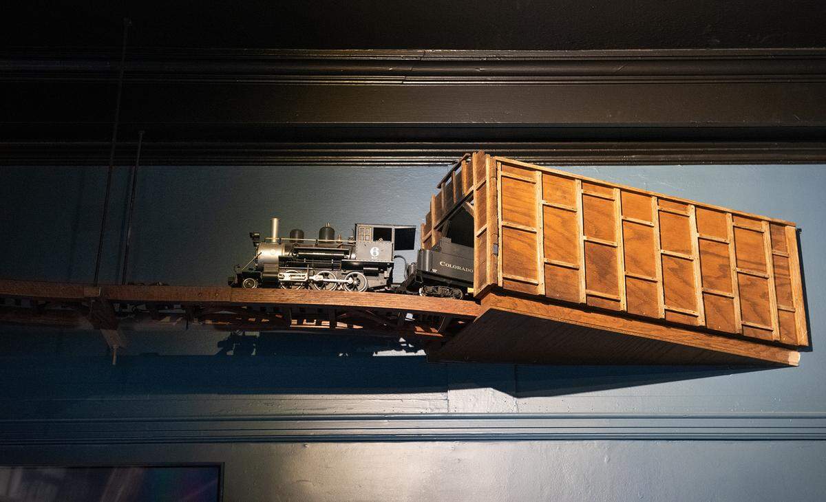 A model train runs through the main room at Central Station Bar and Grill in Turlock, Calif., Tuesday, Dec. 6, 2022.