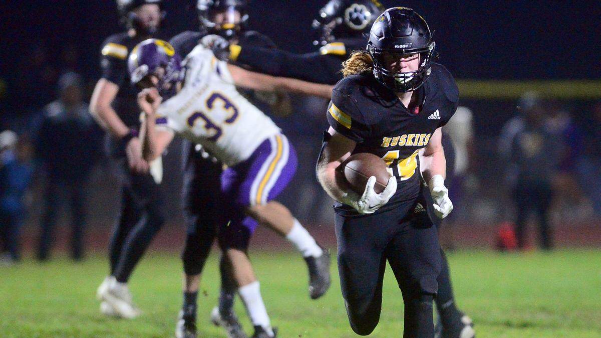 Hughson running back Liam Bridgford (44) sprints upfield during a Division VI CIF Sac-Joaquin Section Football Playoff game between Hughson High School and Orestimba High School at Hughson High School in Hughson CA on Nov. 18, 2022.