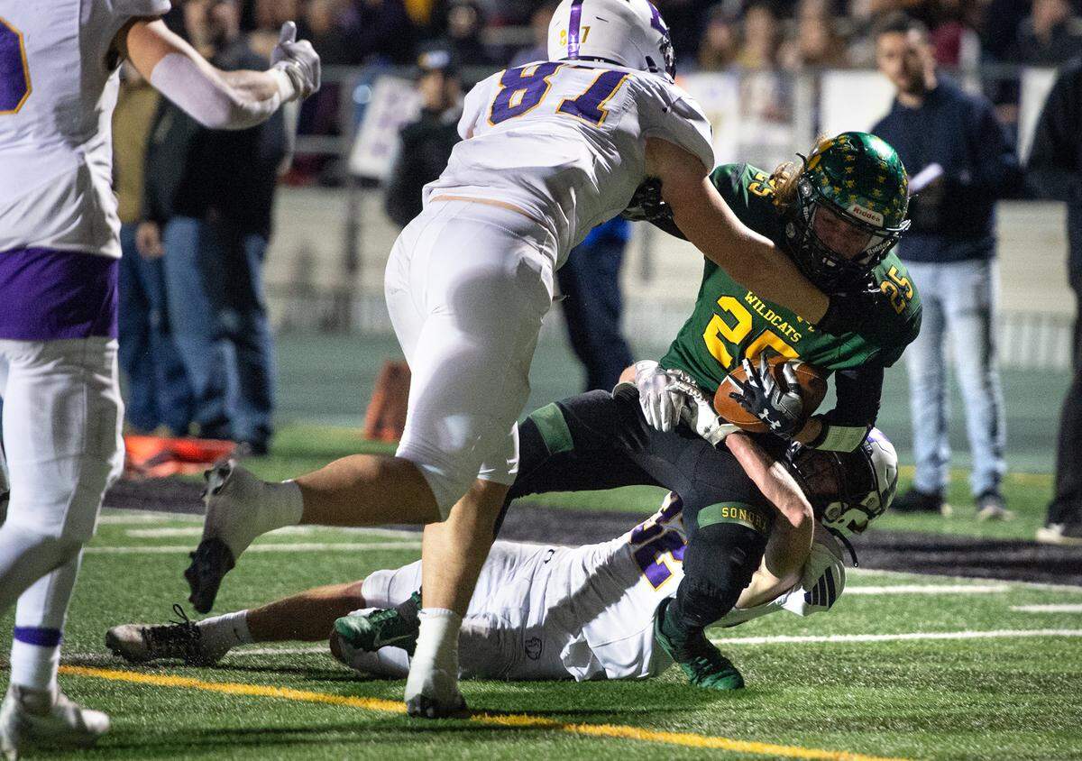Escalon’s Talan Reider and Ryan Lewis take down Sonora’s Noah Baker during the Sac-Joaquin Section Division V championship game at St. Mary’s High School in Stockton, Calif., Saturday, Nov. 26, 2022.
