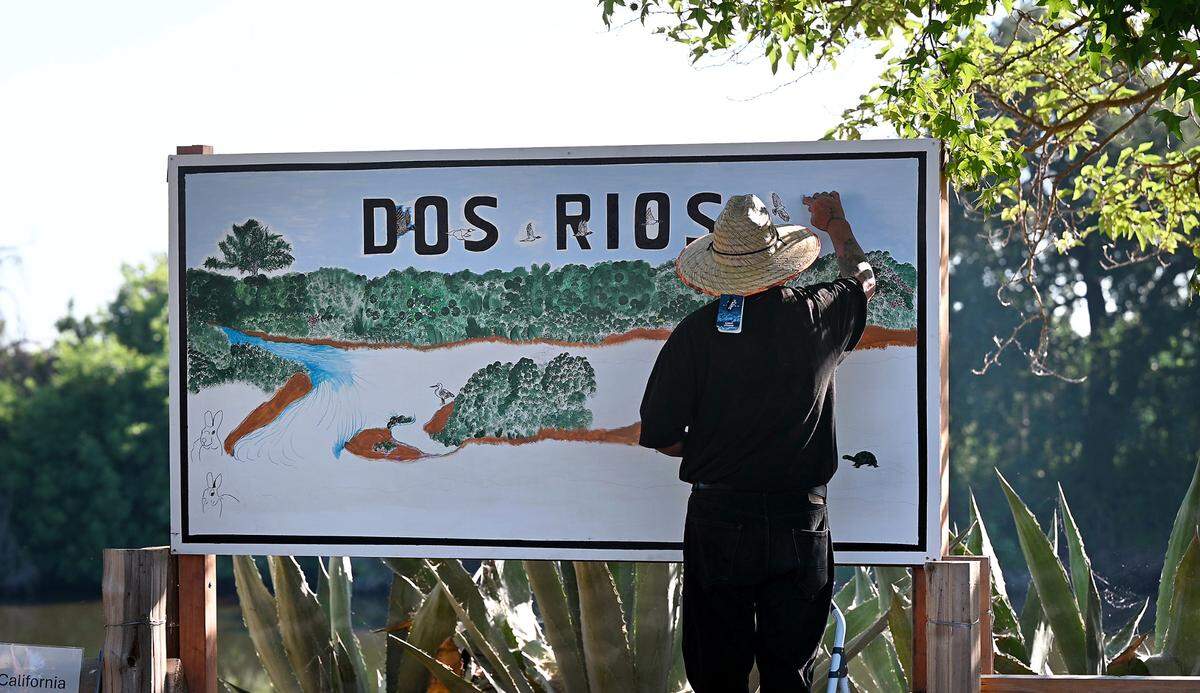 Grayson artist Jose Munoz works on a mural during the opening of Dos Rios State Park in Modesto, Calif., Wednesday June 12, 2024.