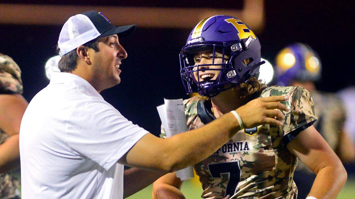 Escalon Head Coach Andrew Beam and quarterback Donovan Rozevink celebrate after scoring a touchdown during a game between Escalon and Windsor at Escalon High School in Escalon California on September 2, 2022.