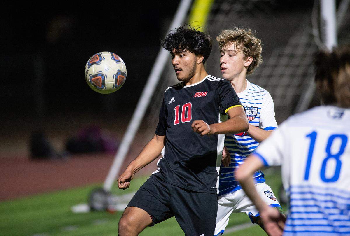 Modesto’s Alexis Luna controls the ball near the goal during the Sac-Joaquin section playoff game with Folsom at Downey High School in Modesto, Calif., on Thursday, Feb. 10, 2022. Luna scored all three goals in Modesto’s 3-0 first-round victory.