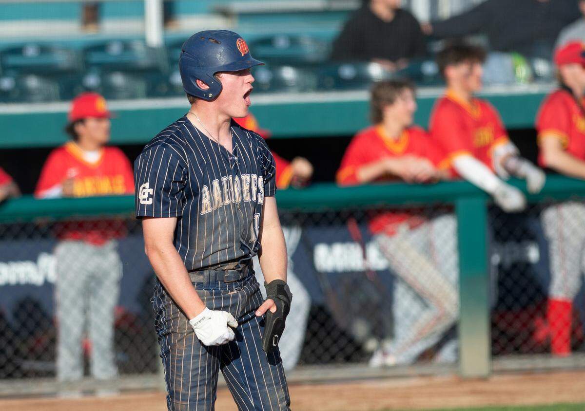 Central Catholic’s TP Wentworth reacts to scoring during the Valley Oak League showcase game with Oakdale at John Thurman Field in Modesto, Calif., Friday, March 31, 2023. Oakdale won the game 10-6.
