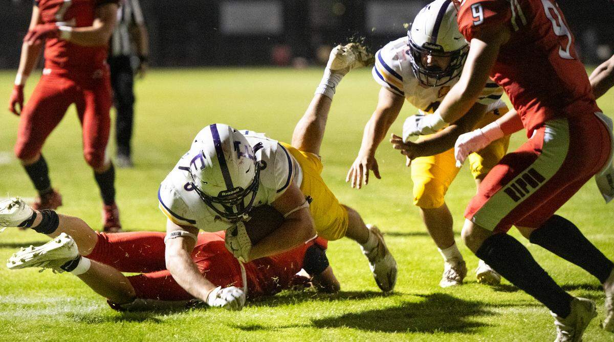 Escalon’s Carson Medina dives into the end zone for a touchdown during the Trans-Valley League game with Ripon at Ripon High School in Ripon, Friday, Oct. 25, 2024.