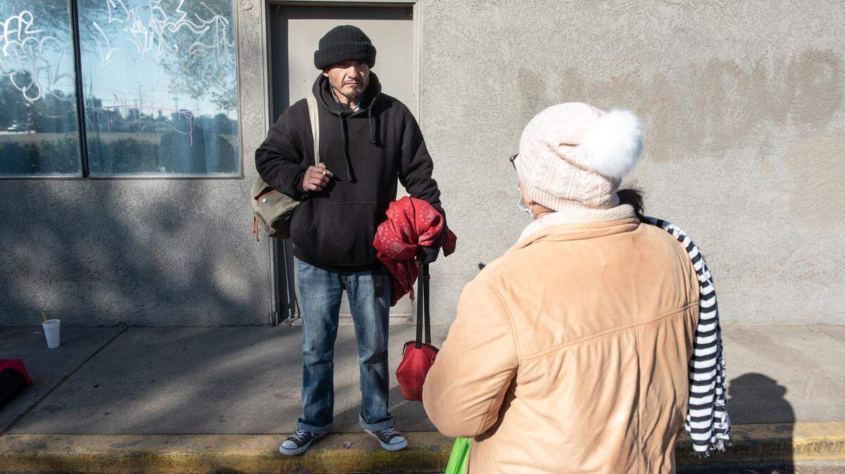 In February, an unsheltered man, Arturo, talks with volunteer Hilda Vega during the annual count of Stanislaus County’s homeless in Modesto. count to receive homeless funding. An emergency housing voucher program that launched in May 2021 and aims to help the homeless and people at risk of becoming homeless is falling well short of its goal.