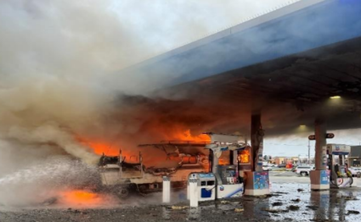 Firefighters from the Modesto Fire Department respond to a fully-involved vehicle fire at a Chevron gas station on the 1500 block of Herndon Road in south Modesto on Tuesday, Jan. 16, 2024.