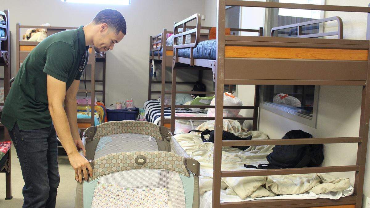 Thomas Hall, lead shelter attendee, checks a crib in the Turlock Gospel Mission’s shelter in Turlock, Calif., on Thursday, July 8, 2021. The city’s declared homeless emergency that increased the shelter’s permitted bed capacity ends July 14.