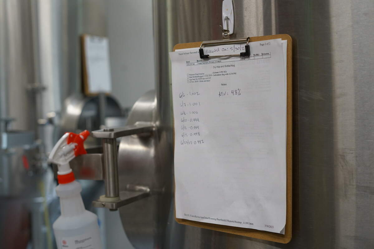 Brethren head brewer Kevin Whitehouse takes “gravity readings,” which show how much sugar is in the mixture, and ultimately how much alcohol is being produced.
