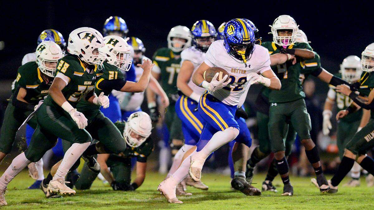 Sutter running back Max Bringgold (22) breaks free during a Sac-Joaquin Division V semifinal playoff game against Hilmar on Friday. 