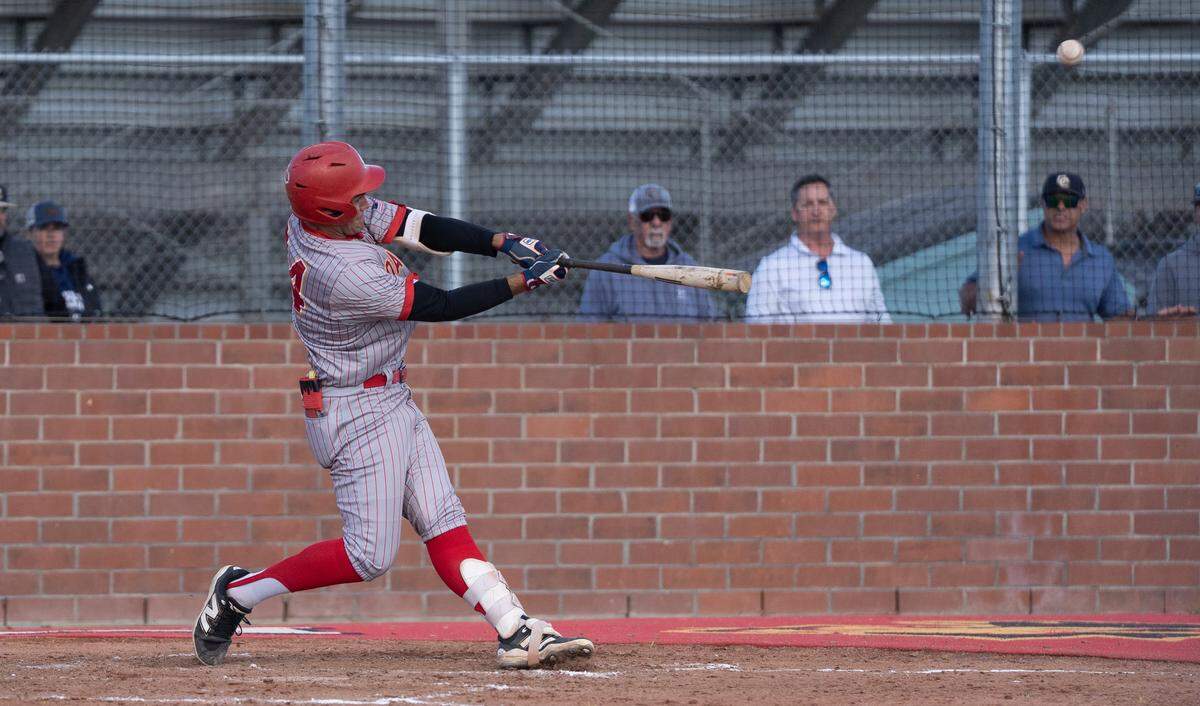 Oakdale’s Landon Schutte sends a double to center field during a Valley Oak League game against Central Catholic at Oakdale High School, Monday, April 13, 2026.