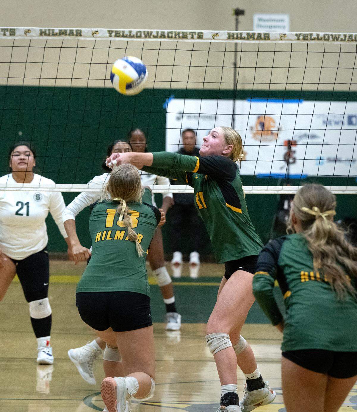 Hilmar’s Reese Ahlem sets the ball during the CIF Northern California Division IV volleyball championship match with St. Patrick-St.-Vincent of Vallejo at Hilmar High School in Hilmar, Tuesday, Nov. 19, 2024. Hilmar won the match 3-0.