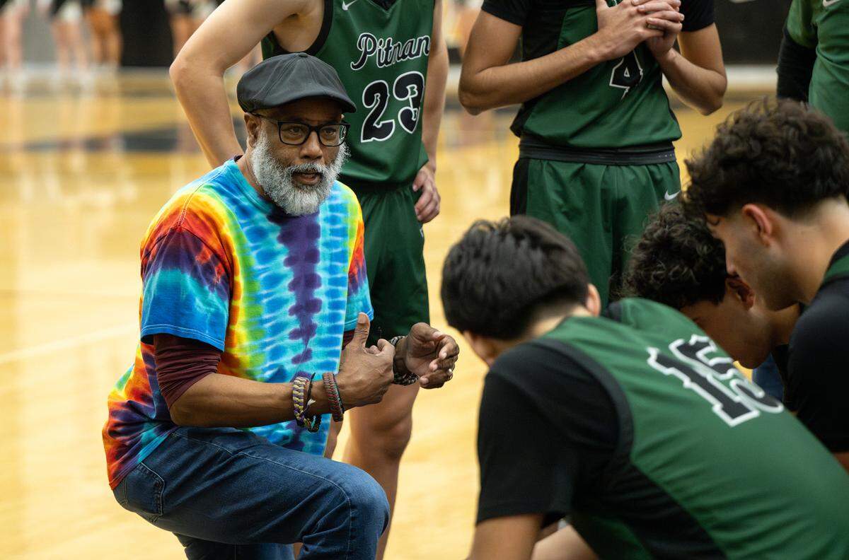 Pitman coach Harvey Marable talks to his starters during a timeout in the Central California Athletic League game with Enochs at Enochs High School in Modesto, Friday, Jan. 24, 2025.
