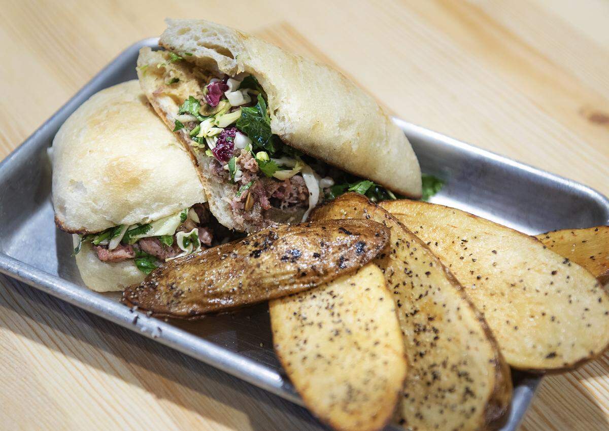 Duck Confit sandwich with fried potatoes at Bauer’s Downtown Gastropub in Modesto, Calif., Wednesday, Nov. 27, 2019.