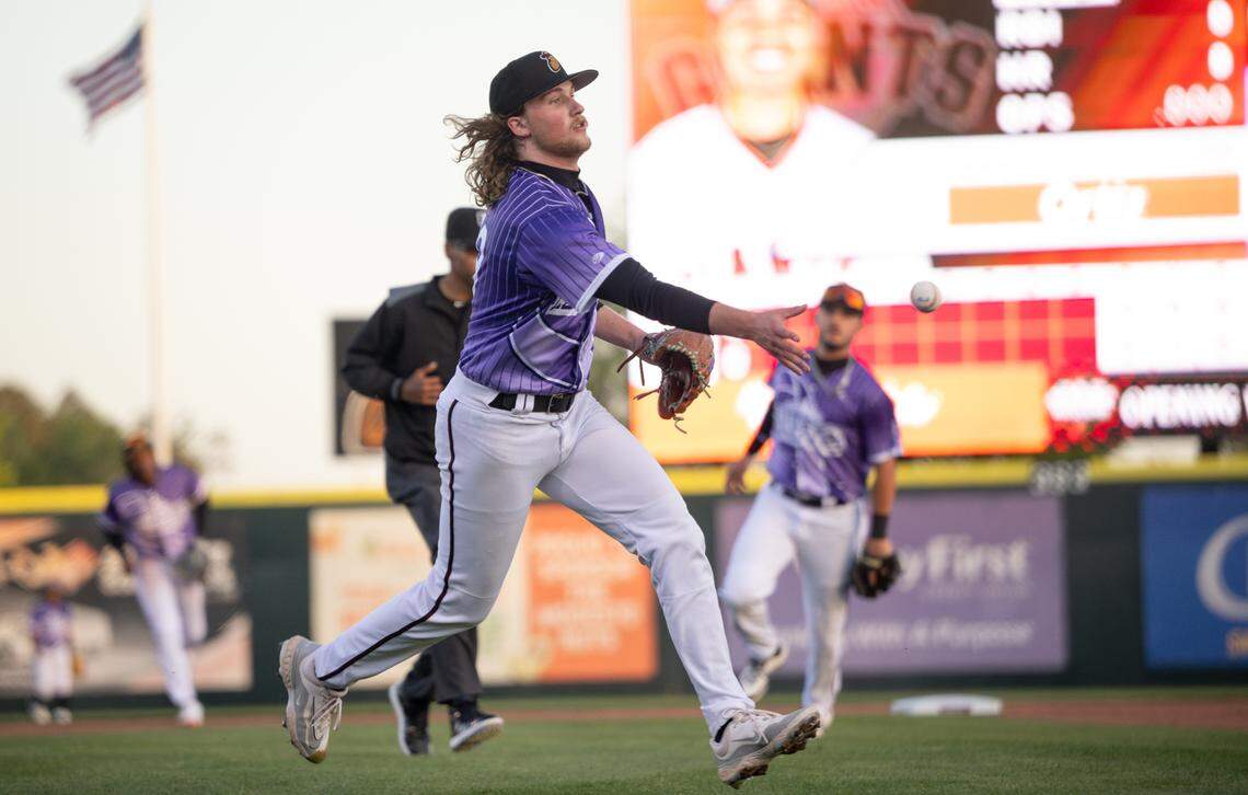 Modesto Nuts pitcher Walter Ford flips the ball to first base for an out during the game with San Jose at John Thurman Field in Modesto, Friday, April 4, 2025.
