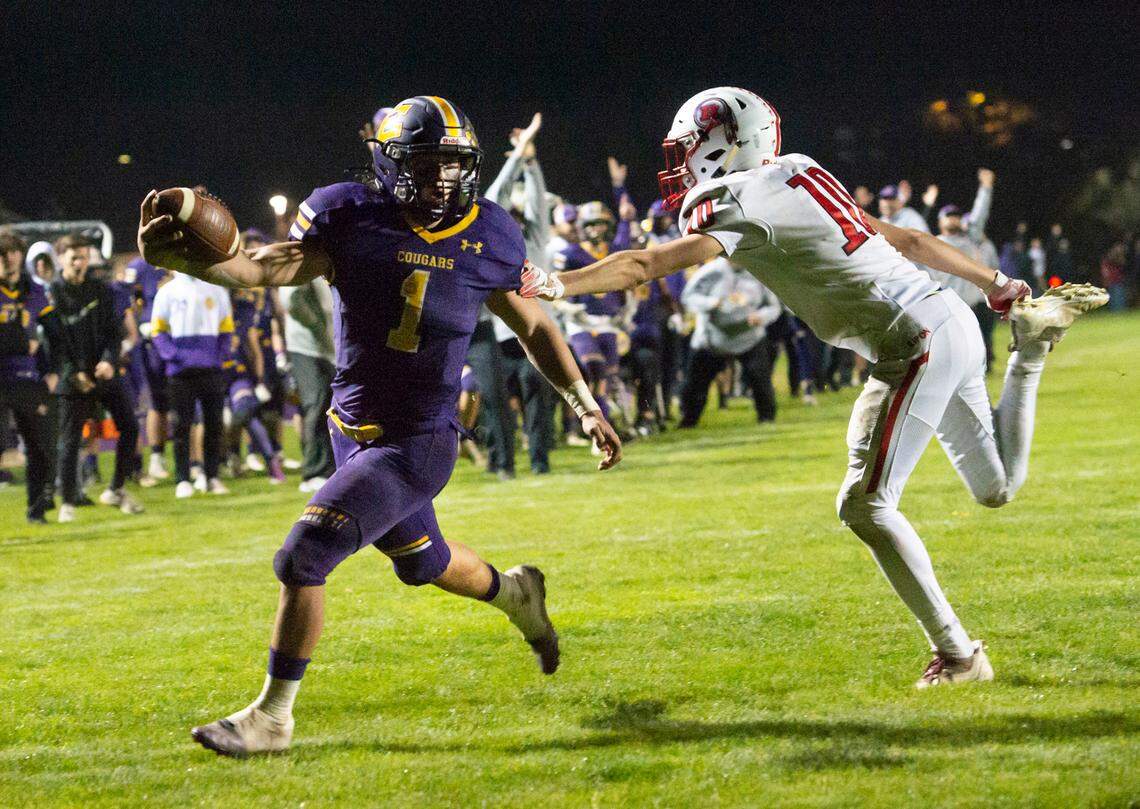 Escalon’s Ryker Peters scores a touchdown past Ripon defender Ryan Lefebvre during the CIF Sac-Joaquin Division V semifinal game in Escalon, Calif., on Friday, Nov. 19, 2021. Escalon won the game 34-10.