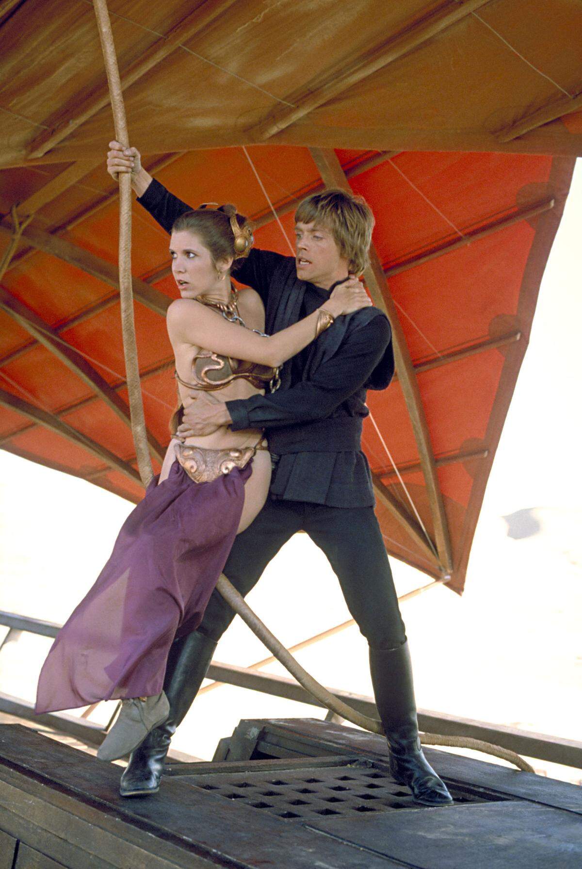 Actors Mark Hamill, as Luke Skywalker, right, and Carrie Fisher as Princess Leia, appear in a scene from “Star Wars: Episode VI, Return of the Jedi,” in this undated promotional photo. Lucasfilm Ltd. and 20th Century Fox announced Tuesday, Feb. 10, 2004, that the original three “Star Wars” films will be released on DVD Sept. 21, 2004, in North America. (AP Photo/Lucasfilm, Ltd. & TM)