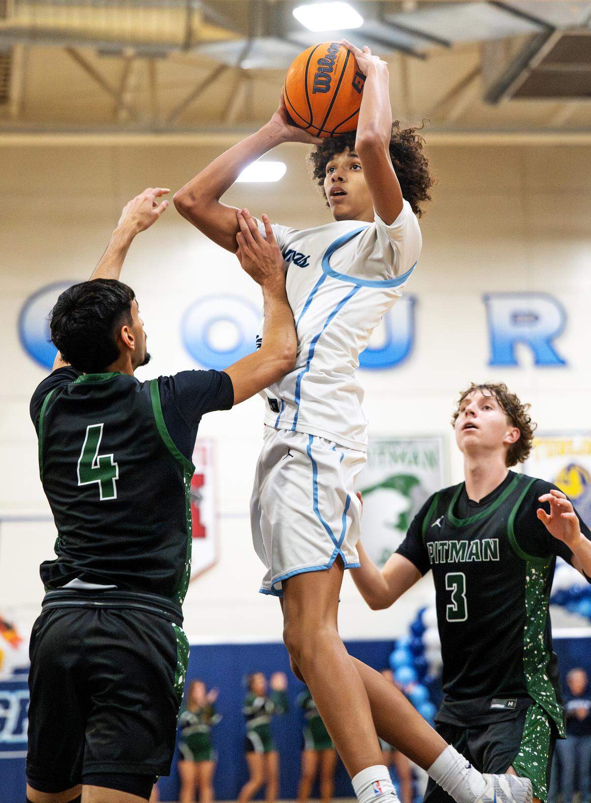 Downey’s Quincy Elder pulls up for a jump shot as Pitman’s Sehaj Bassi defends during the Central California Athletic League game at Downey High School in Modesto on Friday, Jan. 30, 2026.