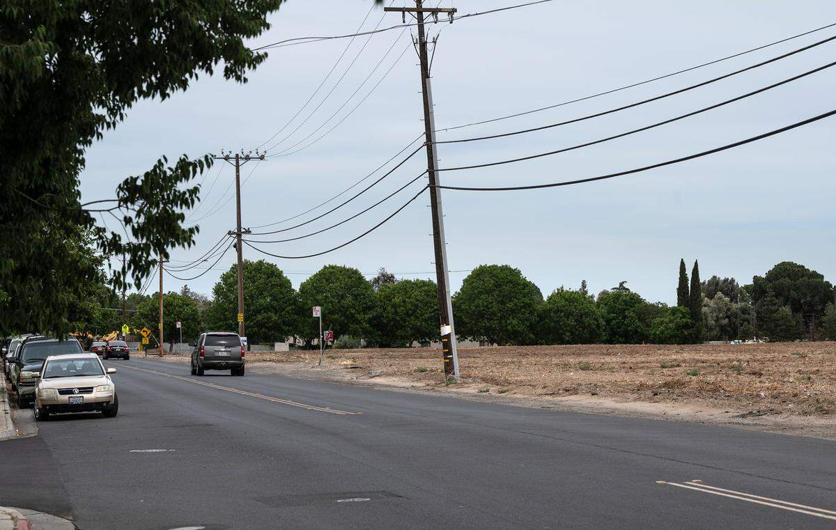 The empty lot on the south side of Robertson Road is a proposed site for Housing Authority apartment complex in Modesto in Modesto, Calif., on Saturday, June 4, 2022.