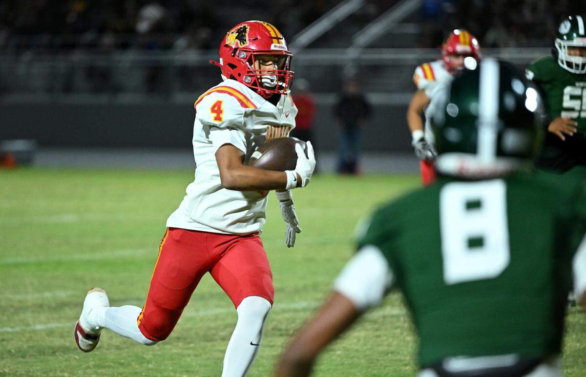 Oakdale Gavin Wyatt runs the ball during the Valley Oak League game with Manteca at Manteca High School in Manteca, Friday, Nov. 1, 2024.