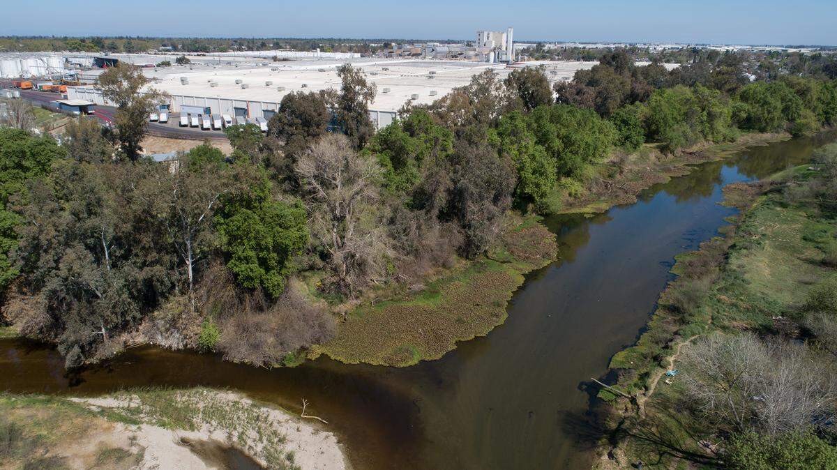 The Modesto City Council has approved a land swap with Gallo Winery. The city is trading the 12-acre Beard Brook Park for a 12-acre, half-mile strip of open land Gallo owns along the Tuolumne River between Dry Creek and Santa Cruz Avenue. Photographed looking east where Dry Creek flows into the Tuolumne River in Modesto, Calif., on Tuesday, March 22, 2022.
