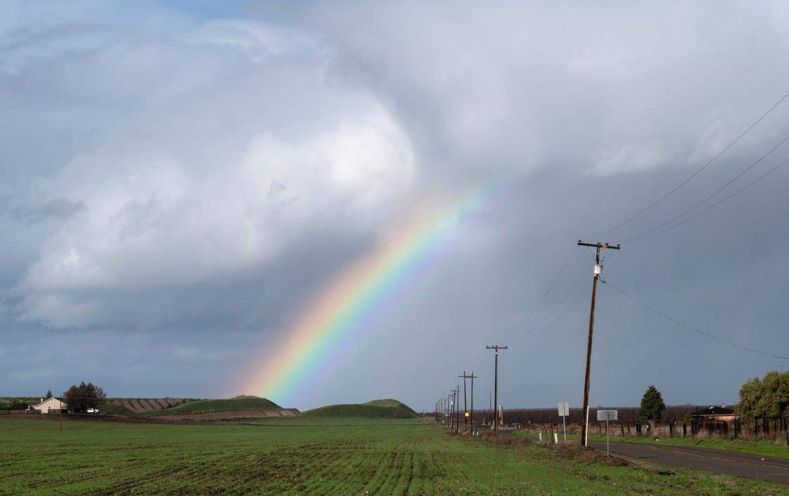 A rainbow is formed in the sky as a storm rolled through west Stanislaus County in Newman, Calif., Tuesday, Jan. 10, 2023. 