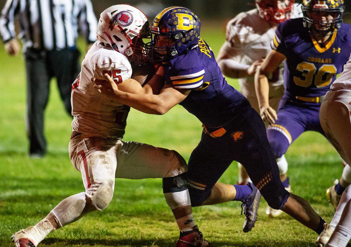 Escalon’s Ryker Peters stops Ripon runner Daniel Espinoza along the line of scrimmage during theTrans-Valley League game in Escalon, Calif., on Friday, Oct. 22, 2021. Escalon won the game 21-7.