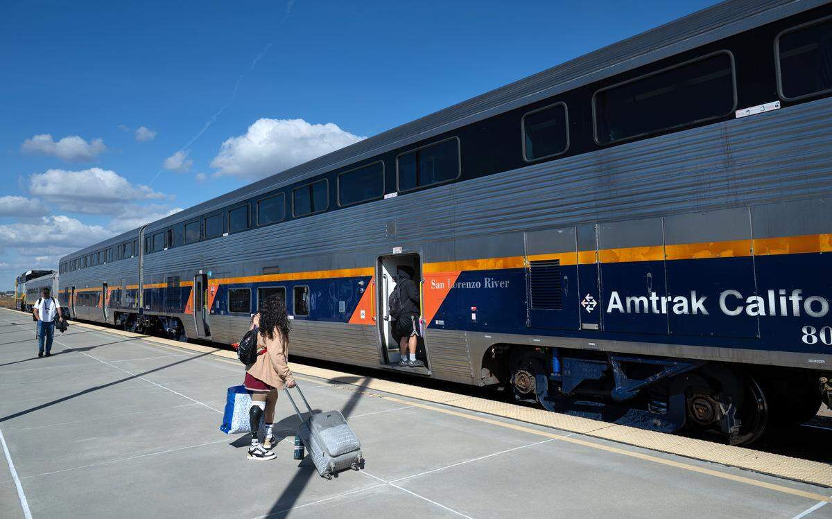 Riders board a southbound train at the Amtrak Station in Modesto, Thursday, Oct. 31, 2024.