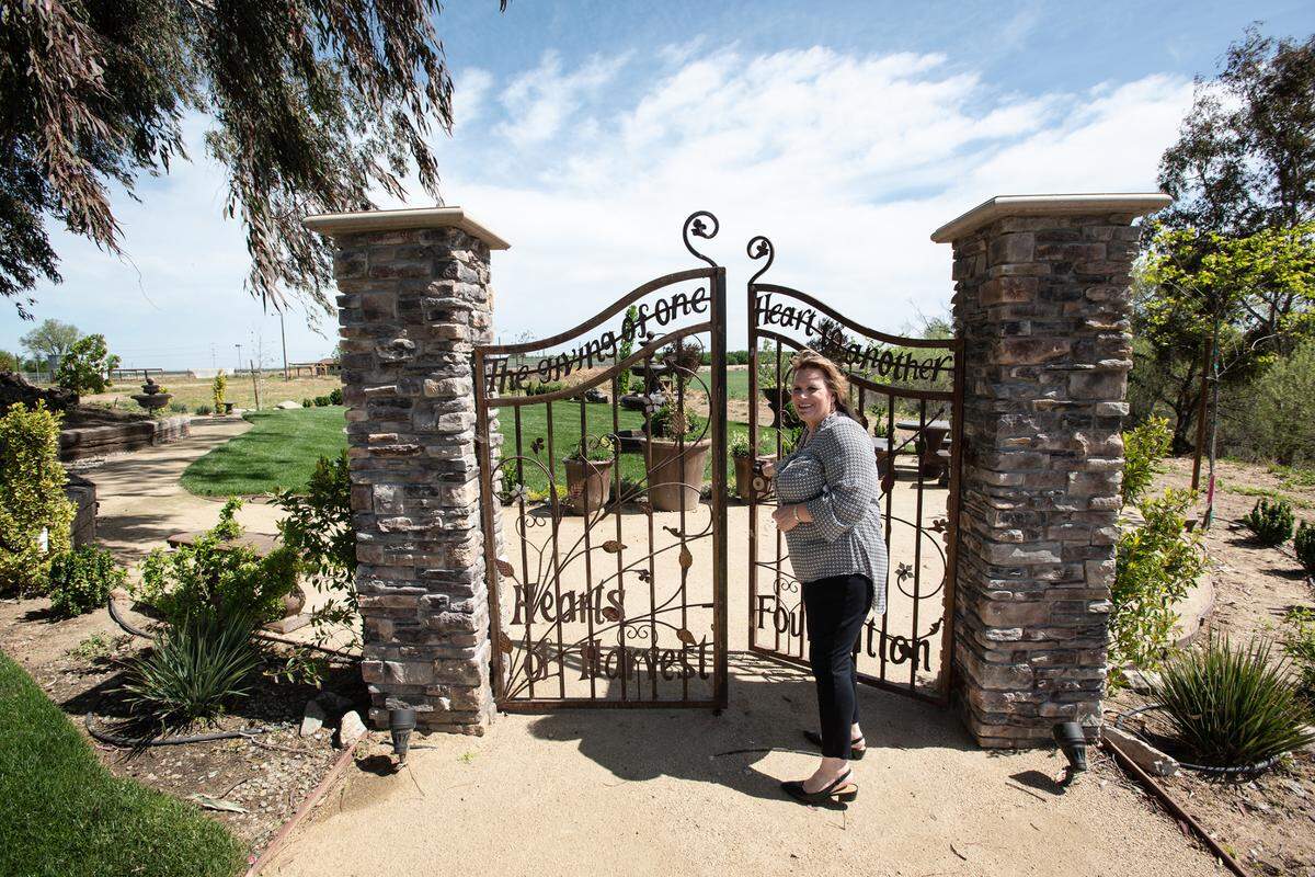 Camp Taylor founder and Executive Director Kimberlie Gamino shows the new water garden at Camp Taylor near Grayson, Calif., on Monday, April 4, 2022.