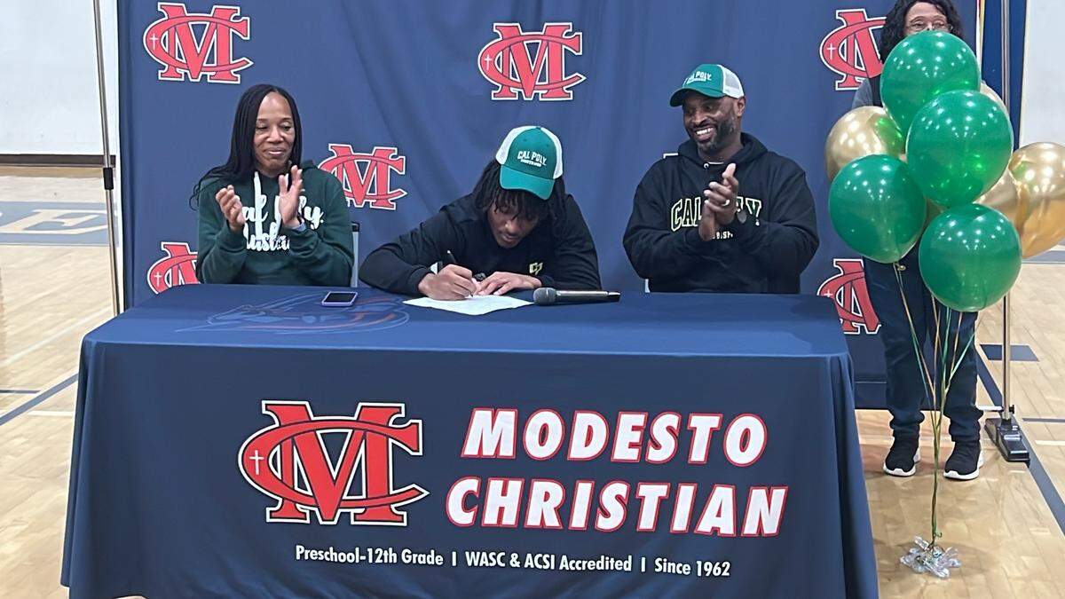 Modesto Christian’s Jeremiah Bernard signs his National Letter of Intent to play football at Cal Poly Pomona on the first day of the National Signing Day Early Period on Wednesday, Dec. 20, 2023.