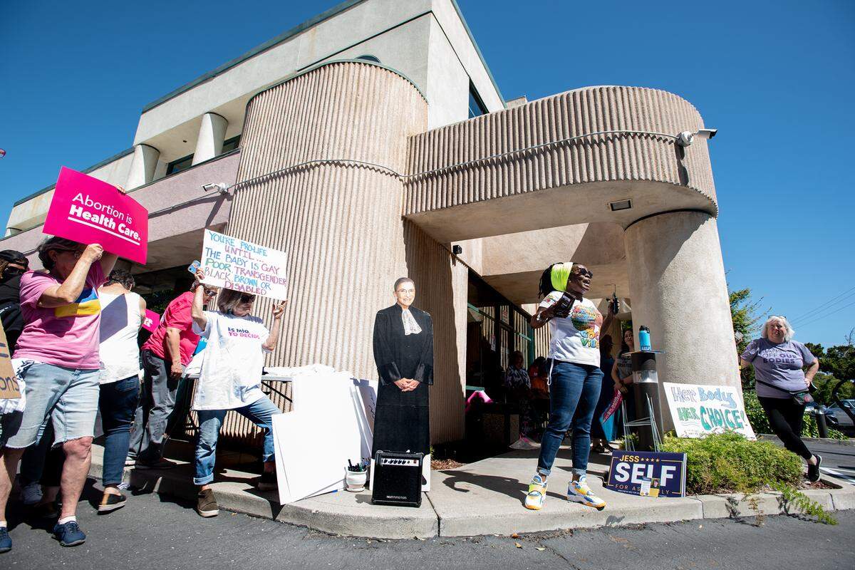 Community activist Navora Edmonds, right, speaks to a crowd assembled at Planned Parenthood during a rally for abortion rights in Modesto, Calif., on Saturday, May 14, 2022.