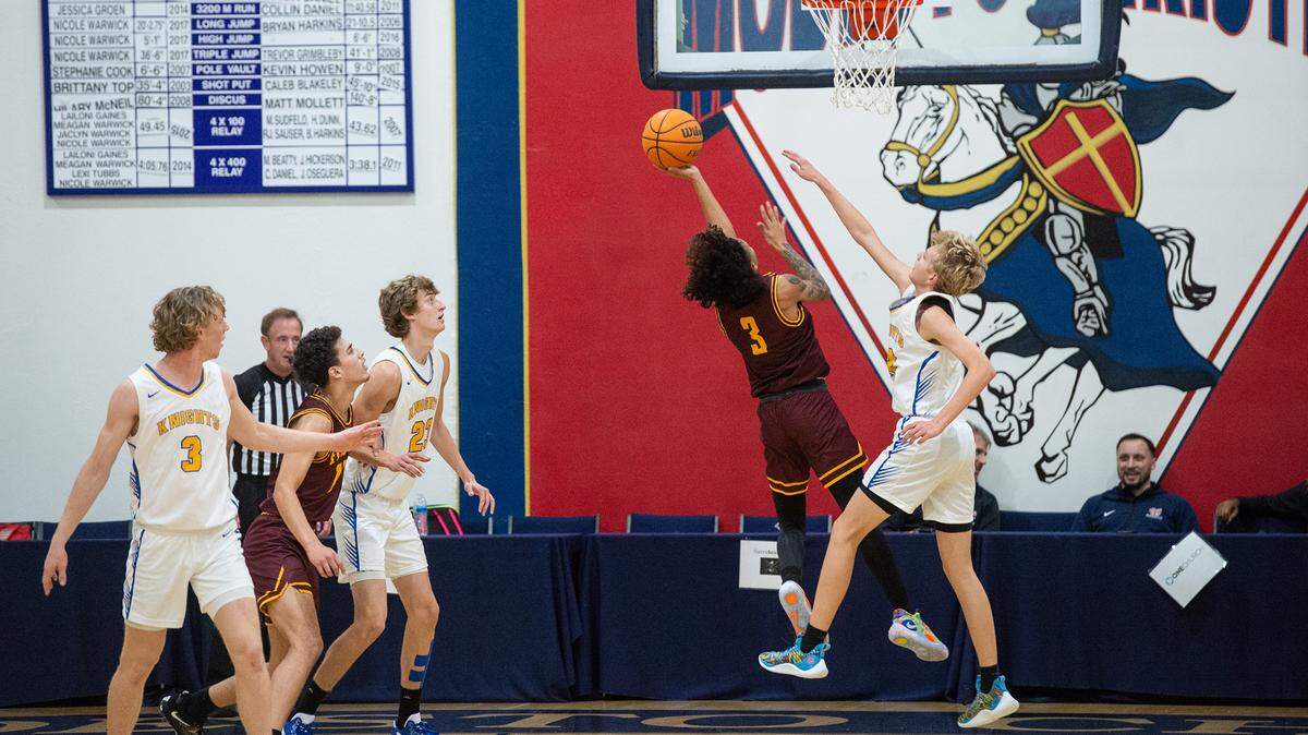 Ripon Christian’s Justin Hofman defends on Edison’s Leon Mills Jr. during the Modesto Christian Holiday Hoop Classic game at Modesto Christian High School in Salida, Calif., Thursday, Dec. 29, 2022.