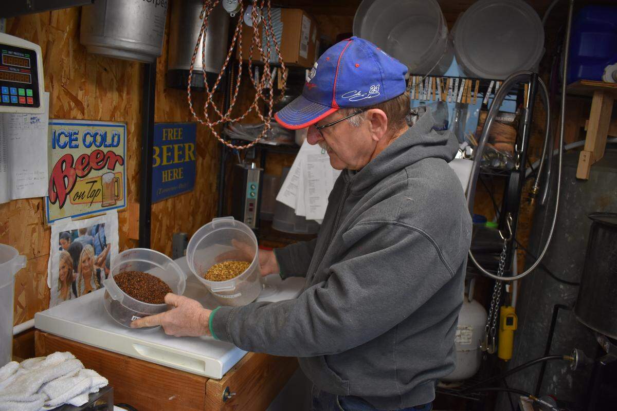 In the brewing shed at his Shoemake Avenue home in Modesto, Les Alderson shows a couple of the flavoring ingredients he uses in his craft beer. For the 10th year, Alderson will set up a beer stop for runners on the Modesto Marathon 26.2-mile course on Sunday, March 31, 2019.