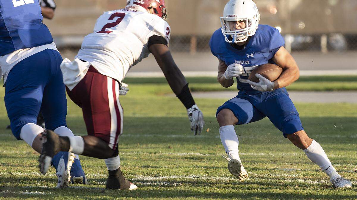 Modesto Michael Ramos runs into Sierra defender Joshua Cannon at Modesto Junior College in Modesto, Calif., Saturday, Sept. 14, 2019. MJC won the game 50-20.