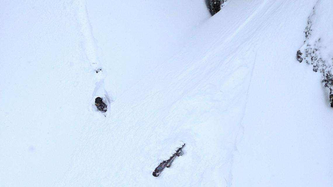 This photo of Justin Calbert, fully submerged as only his snowboard sticks out from the snow, was taken by Josh Emmons. Emmons was riding Chair 3 at Dodge Ridge and, when he got off, was among those to went to help Calbert.