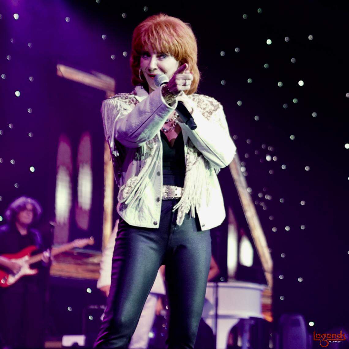 Corrie Sachs performs as Reba McIntire in the Legends of Country tribute production.