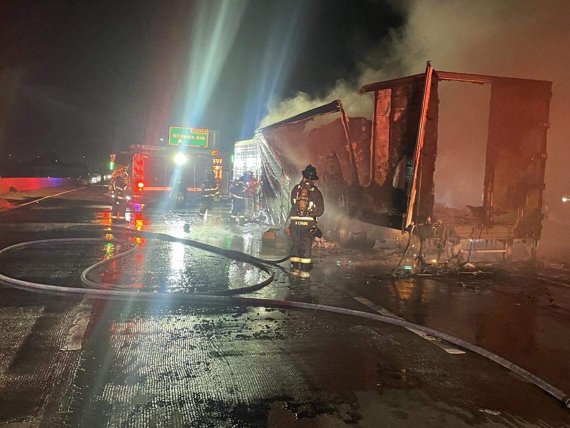 Firefighters extinguish a burning semi-trailer on Highway 99 near Ceres late Thursday night. Crews used water tenders to supply water because there are no hydrants along the highway.